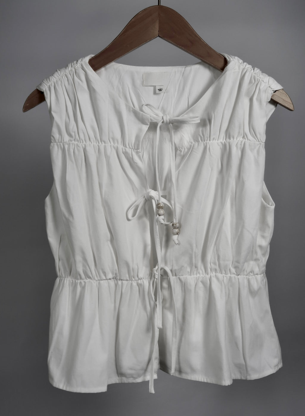 The Bead Peplum Top