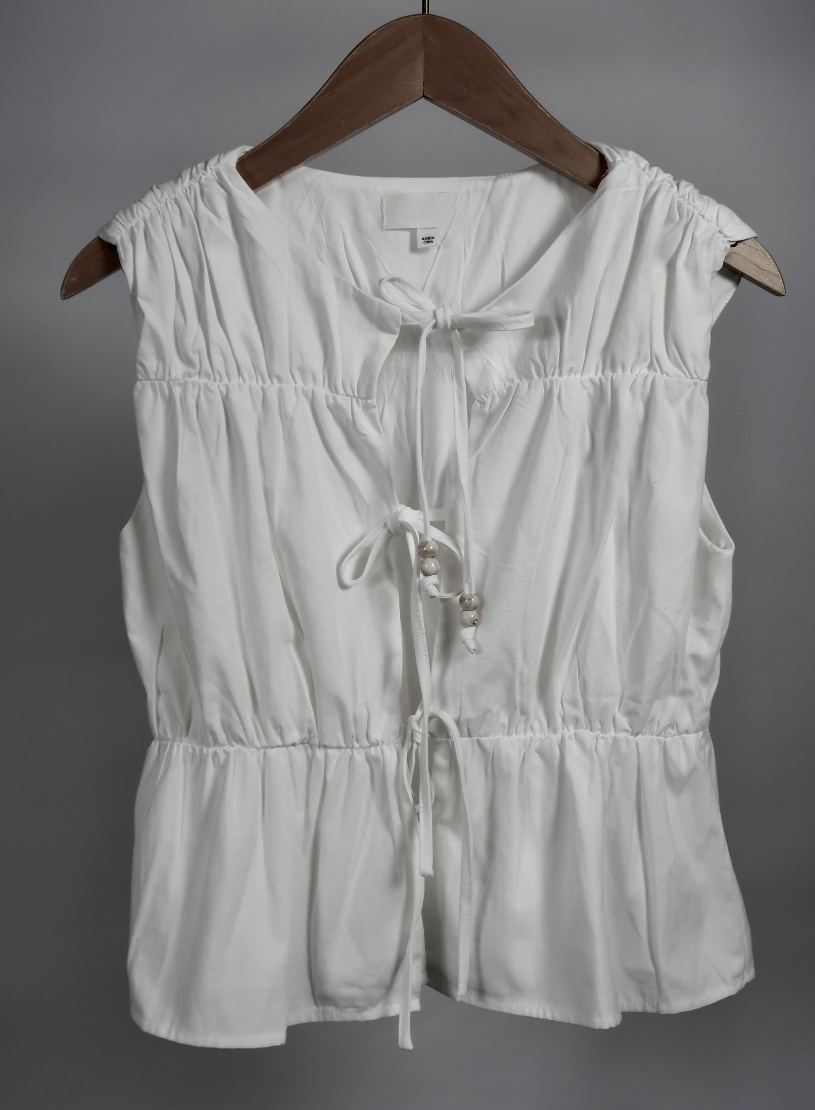 The Bead Peplum Top