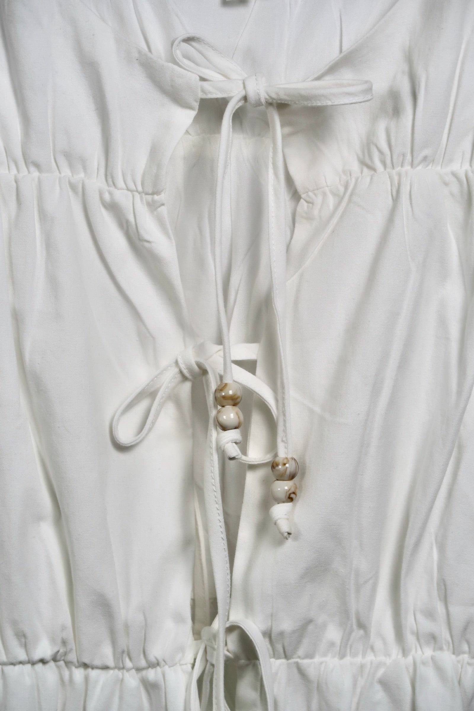The Bead Peplum Top