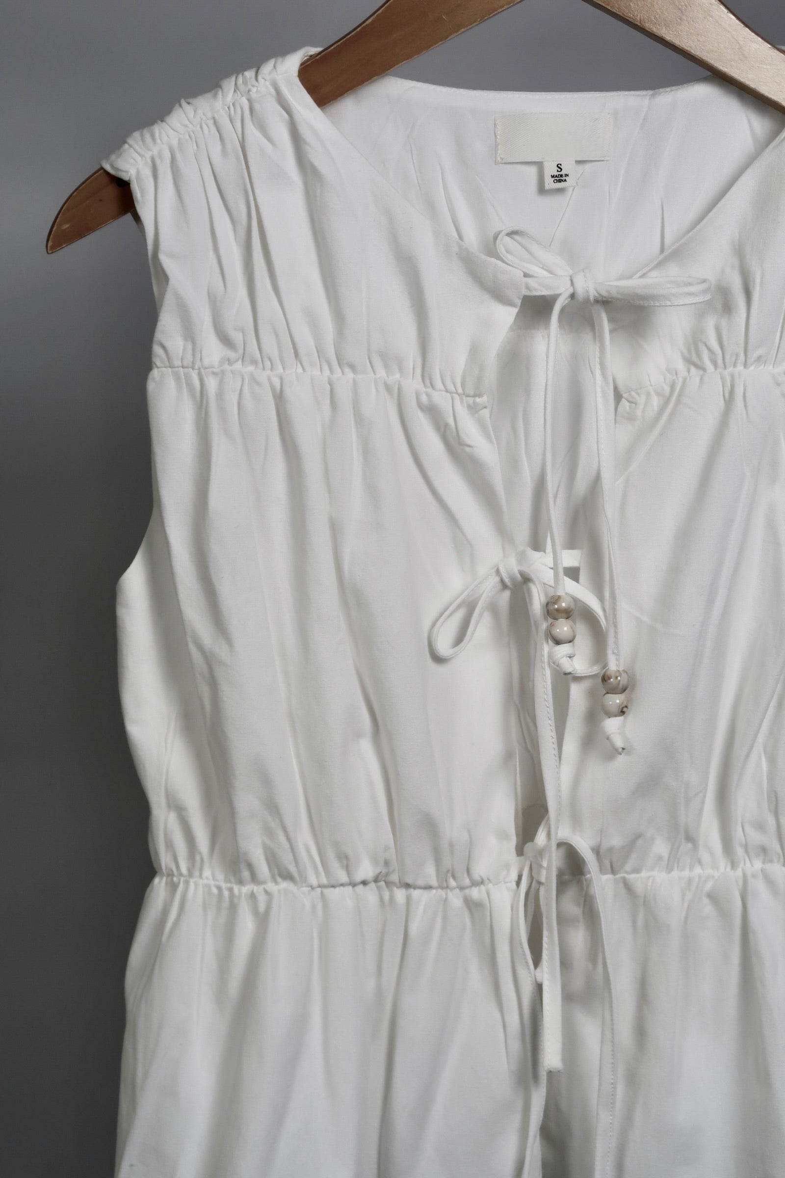 The Bead Peplum Top