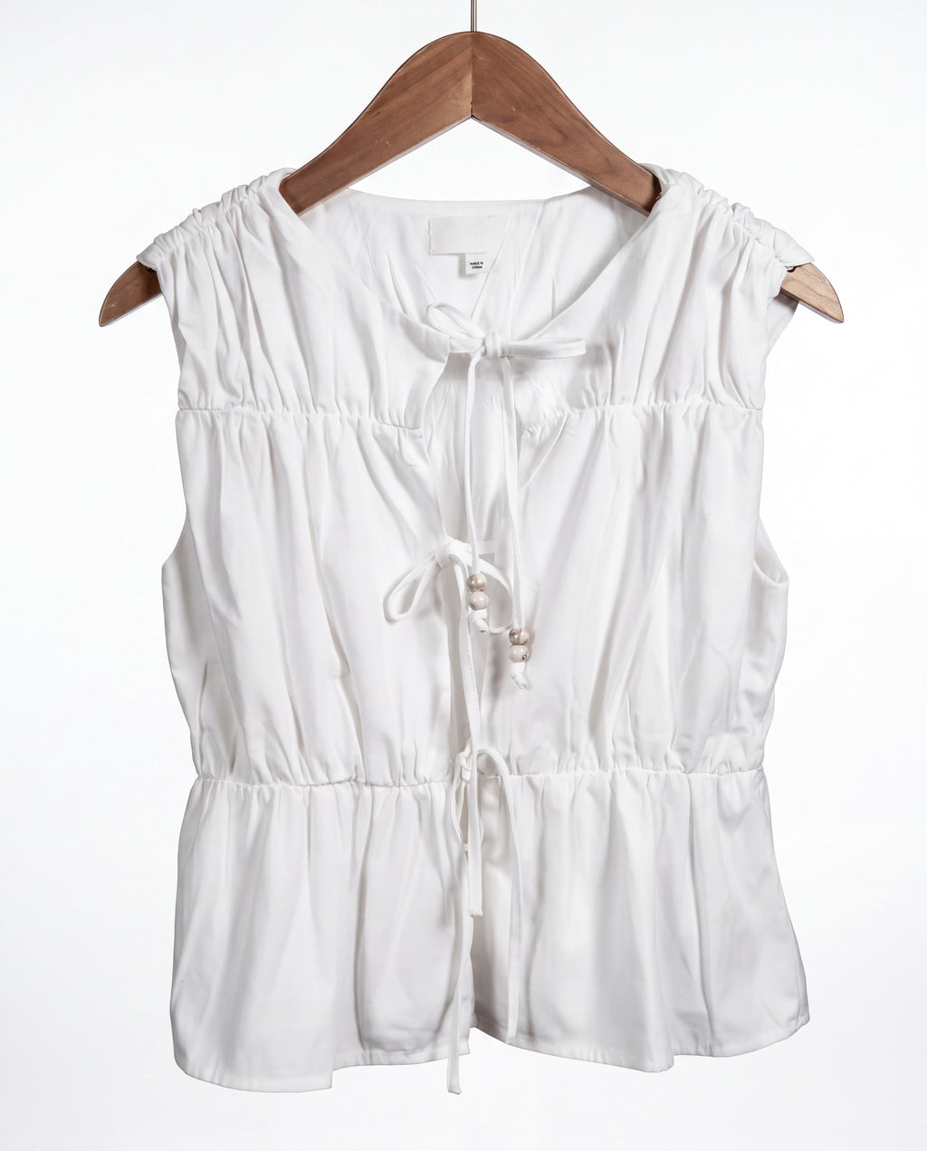 The Bead Peplum Top