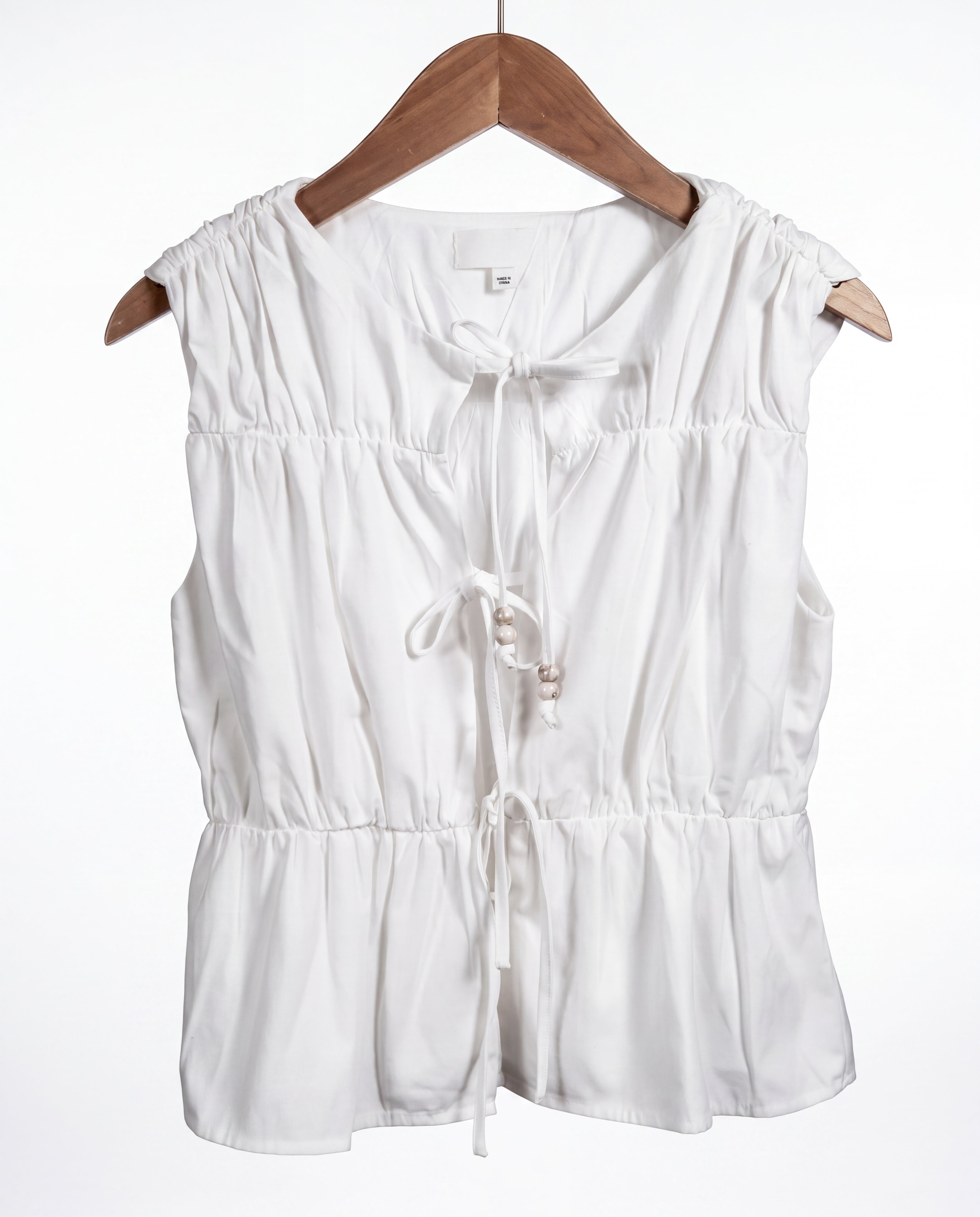 The Bead Peplum Top